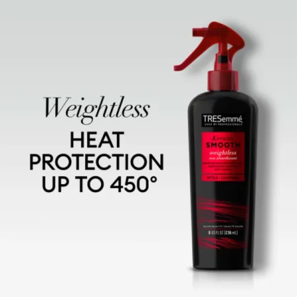 Applying tresemme heat protectant spray to damp hair